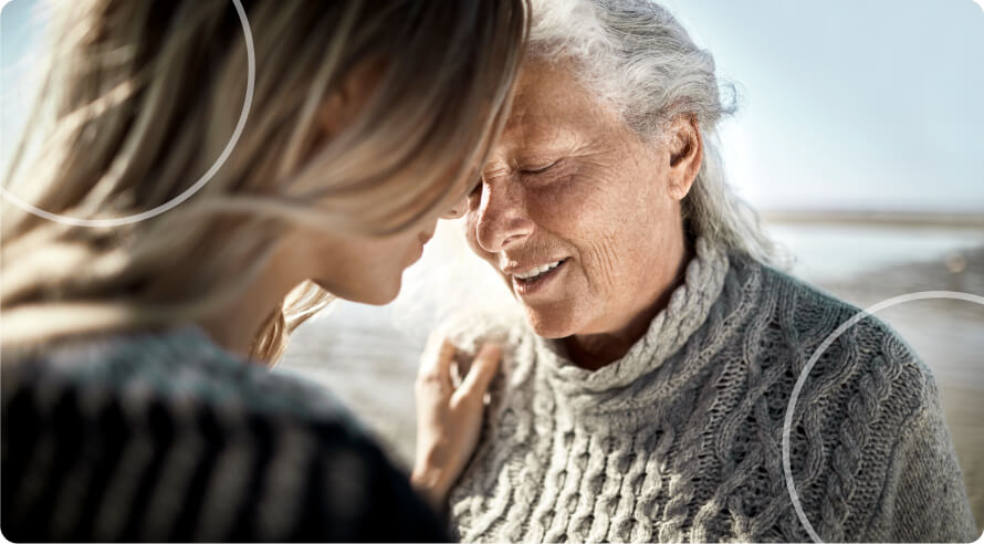a young adult talking to elder person