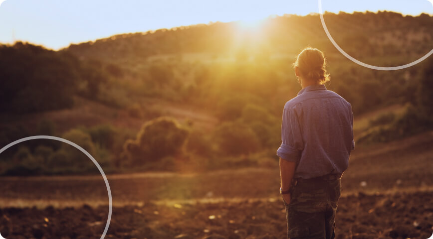 man looking at sunset